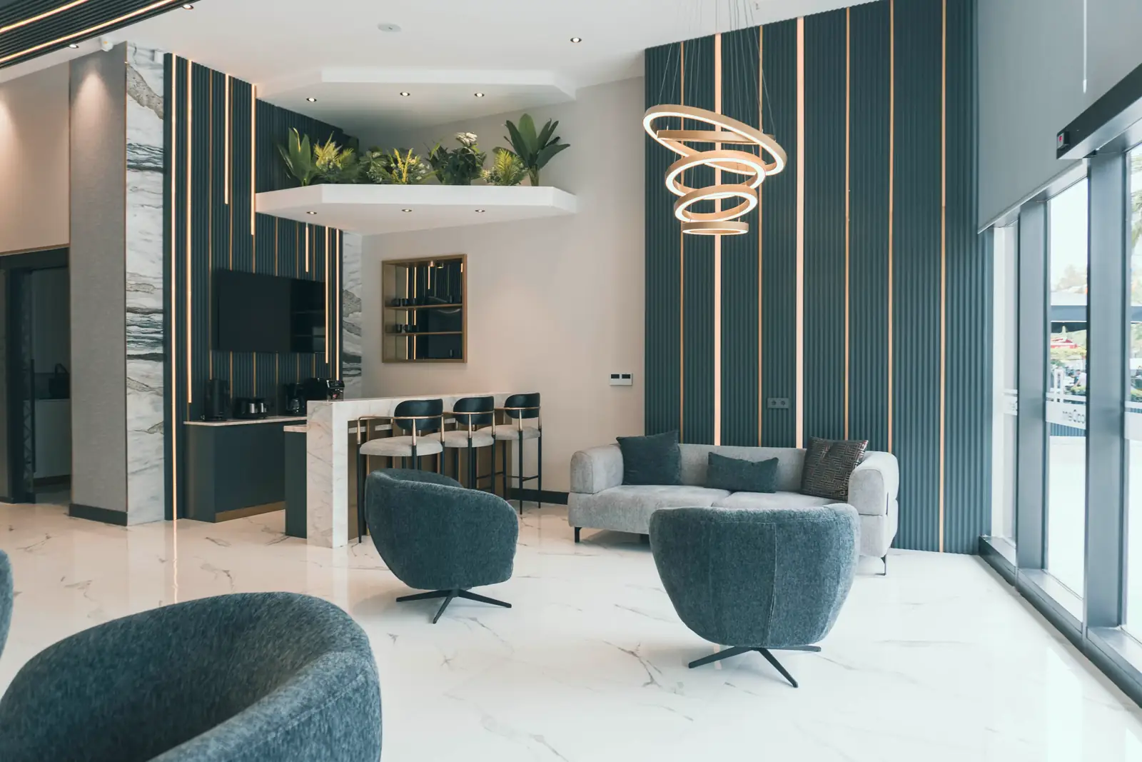 The waiting lounge at Locadent, seating under a marble wall